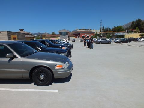 2003 Ford Crown Victoria - Side view of a silver Crown Victoria on black steel wheels on a shopping-center deck