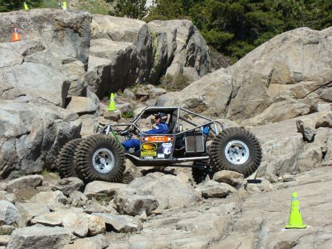 1989 Ford Bronco - A custom-built off-road buggy tackles a challenging rocky course.
