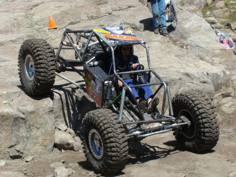 1989 Ford Bronco - Custom buggy navigating a rocky obstacle course with a driver at the wheel.