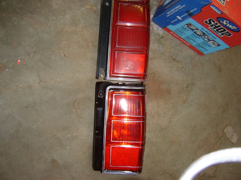 Pair of red taillights with chrome trim