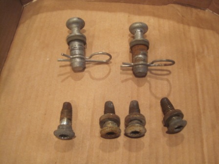 1993 Ford Bronco - A collection of assorted automotive hardware, including pins and bolts, is displayed on a plain background.