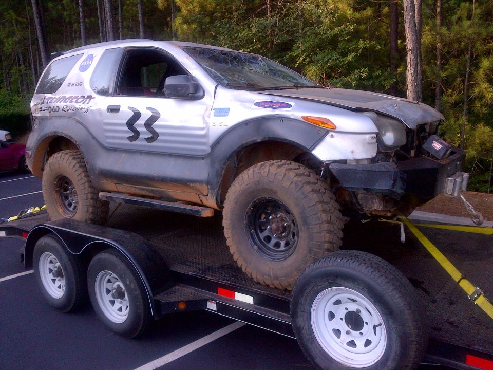 1999 Isuzu Vehicross with off-road tires on a trailer, number 33 on door