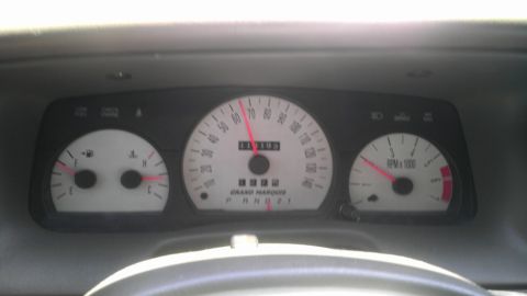 2000 Mercury Grand Marquis - The dashboard of a 2000 Mercury Grand Marquis shows the speedometer, odometer, and tachometer readings.