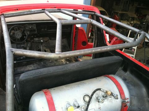 1978 Ford Bronco - Custom roll cage and air tank installed in the interior of a 1978 Ford Bronco.