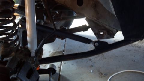 1995 Jeep Cherokee - Front suspension components of a 1995 Jeep Cherokee, showing shock and control arm.