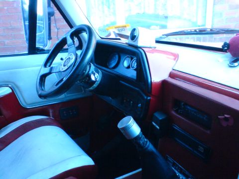 1989 Ford Bronco - Interior view of a 1989 Ford Bronco, an aftermarket steering wheel and gauges.