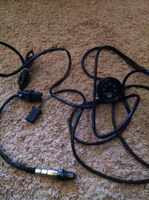 1991 Eagle Talon - Oxygen sensor and AEM wideband gauge with wiring laid out on carpet.
