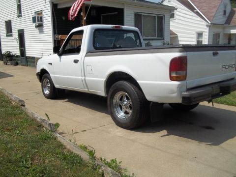 1970 Ford Ranchero - White Ford pickup truck parked on a concrete driveway.