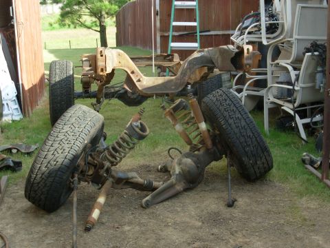 1983 Ford Bronco - With the front of the frame on the 2-post, I knocked out the front axle bolts. I'm not looking forward to handling this %&@#($!! [url=http:…