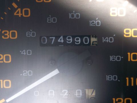 1988 Suzuki Samurai - The odometer displays 74,990 miles on this vehicle's dashboard, with the speedometer calibrated up to 140.