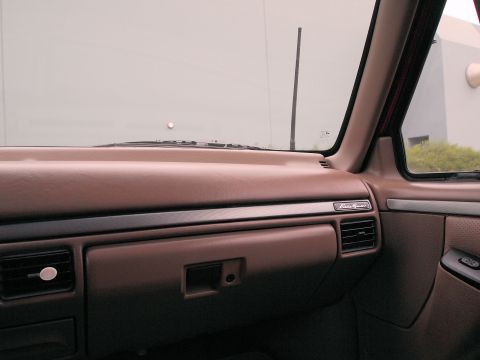 1994 Ford Bronco - Interior view of a 1994 Ford Bronco, highlighting the dashboard and passenger side controls.