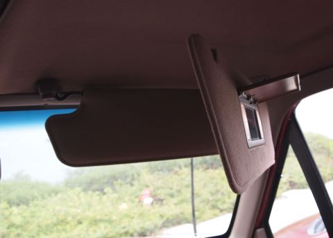 1994 Ford Bronco - Interior view of a sun visor with a vanity mirror, seen from the passenger side.