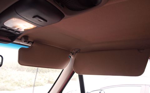 1994 Ford Bronco - The interior ceiling and sun visors are visible in this photograph.