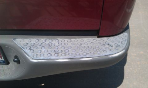 2003 Ford Sport Trac - Rear bumper step pad showing wear and tear from use.