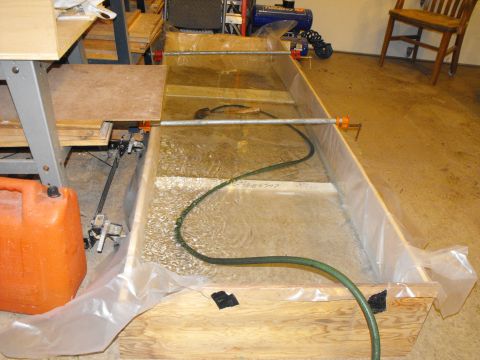 1986 Ford Bronco - The core support on the Bronco was so big I whipped together this plywood frame with scraps and lined it with 6 mm plastic. It's filling wi…