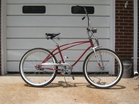 1994 Ford Bronco - Cruiser bicycle with whitewall tires and chrome handlebars.