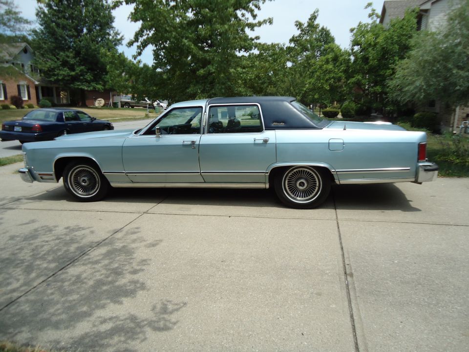 Light blue 1979 Lincoln Continental sedan, side view, black vinyl roof