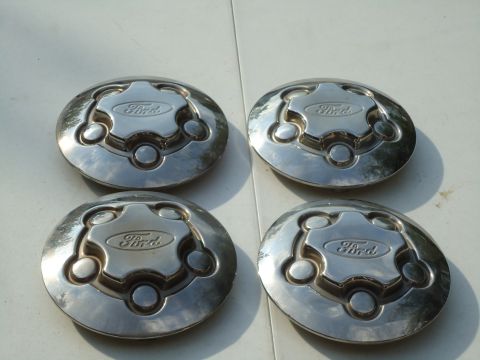 2001 Ford Crown Victoria - Set of four Ford hubcaps for sale.