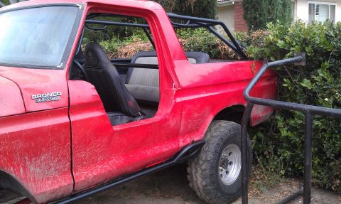 1978 Ford Bronco - This 1978 Ford Bronco Custom features a prominent roll cage and off-road modifications.