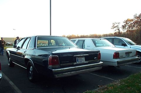 1991 Ford LTD Crown Victoria - Rear view of a 1991 Ford Crown Victoria LTD parked in a lot with other vehicles.