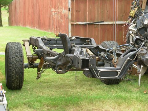 1983 Ford Bronco - Under the lift, I got the rear shackles bolted up, and then picked up the front.