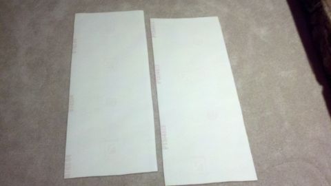 1900 Ford C-350 (Centurion Conversions) - Two blank white papers are shown on a carpeted surface.