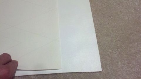1900 Ford C-350 (Centurion Conversions) - A hand holds a piece of paper with a subtle grid pattern drawn on it.