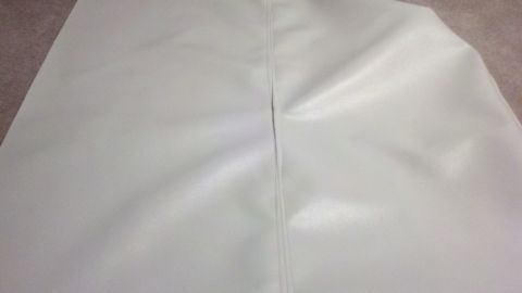 1900 Ford C-350 (Centurion Conversions) - Close-up of white vinyl material, likely a cover or upholstery piece.