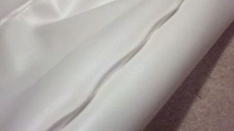 1900 Ford C-350 (Centurion Conversions) - This image shows a close-up of white fabric, not a 1900 Ford C-350 (Centurion Conversions) boat.