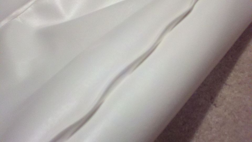 White fabric with a seam, close-up