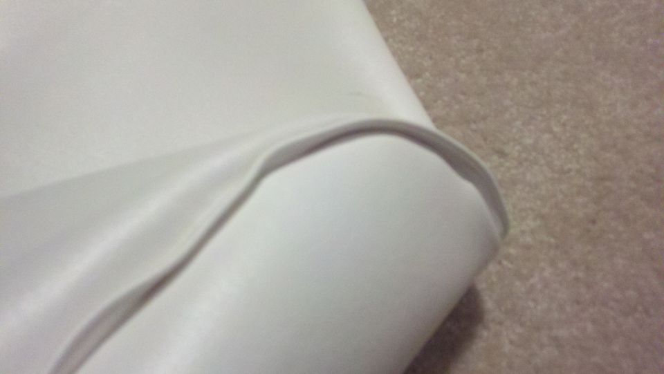 White upholstery detail with curved edge
