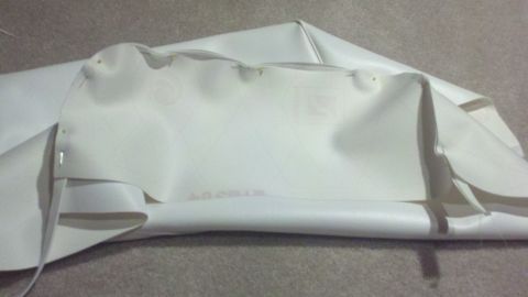 1900 Ford C-350 (Centurion Conversions) - A white vinyl boat top is shown, with visible stitching and a SuperMotors watermark in the corner.