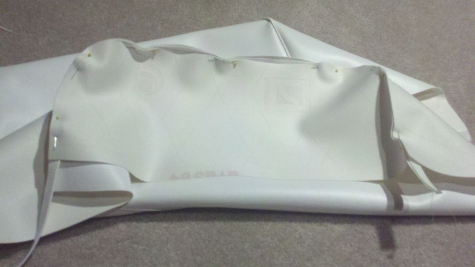 White vinyl boat top with visible stitching and a SuperMotors watermark