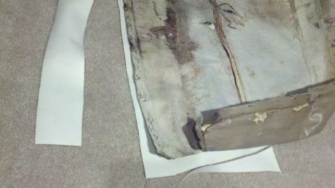 1900 Ford C-350 (Centurion Conversions) - Close-up of damaged interior upholstery and trim, with a SuperMotors watermark visible.