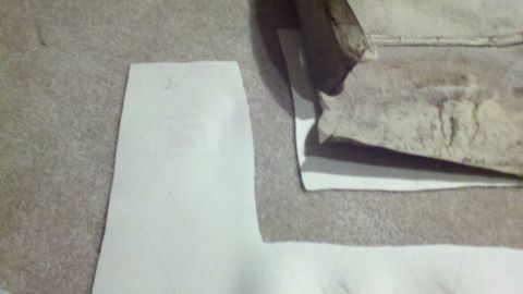1900 Ford C-350 (Centurion Conversions) - A fabric swatch with a geometric pattern is shown next to a piece of textured material, with a Supermotors logo at the bottom.