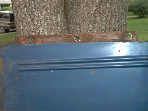 1971 Ford Bronco - Blue metal panel with horizontal ridges, possibly a car door or fender section.