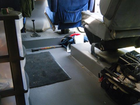 1988 Ford E350 - Interior view of a van, showing seats, floor, and gear shifter.