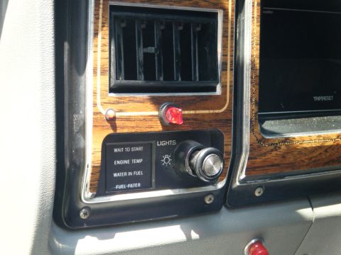 1988 Ford E350 - Interior view of a vehicle's dashboard, showing various warning lights and controls.
