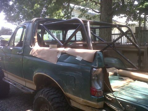 1990 Ford Bronco - Custom roll cage installation in a 1990 Ford Bronco, showing the rear and interior.