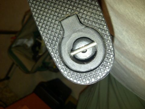 1989 Ford Bronco - A close-up view of a textured part a circular fastener secured by a pin. The registry claims it is a 1989 Ford Bronco, but this is not evid…