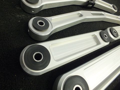 2003 Ford Crown Victoria - Detail of machined aluminum suspension arms, bushing eyes facing the camera.
