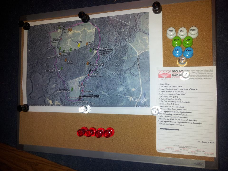 Corkboard with a map, to-do list, and pushpins