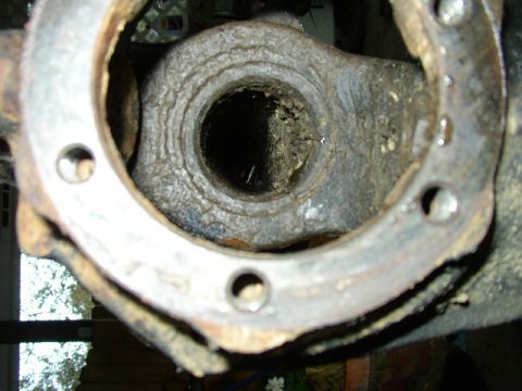 1995 Ford Bronco - Close-up of a corroded metal component, likely from a vehicle's drivetrain.