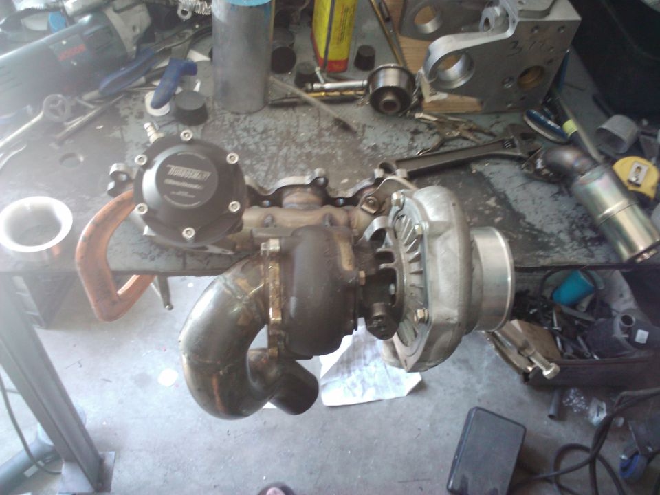 Turbocharger with black wastegate assembly