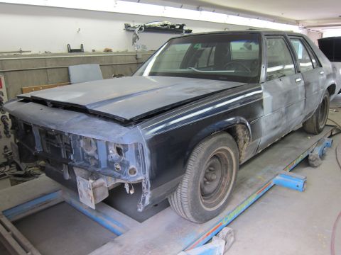 1991 Ford LTD Crown Victoria - Ford Crown Victoria undergoing body work in a repair shop.