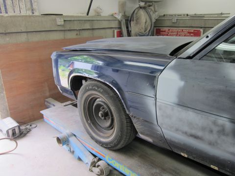 1991 Ford LTD Crown Victoria - Front fender and wheel of a 1991 Ford Crown Victoria LTD on a lift.