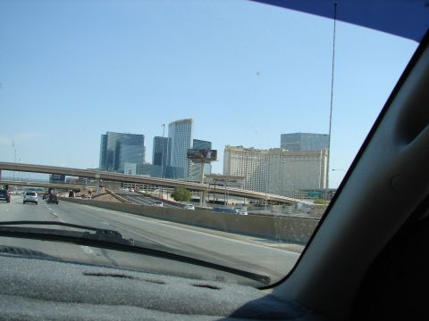 1992 Ford Taurus - View of the Las Vegas skyline from a highway, numerous hotels and casinos under a clear blue sky.