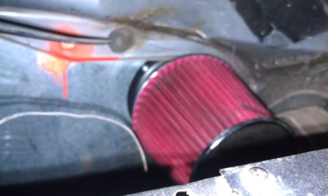 1978 Ford Bronco - Close-up of a red engine air filter, likely part of an aftermarket intake system.