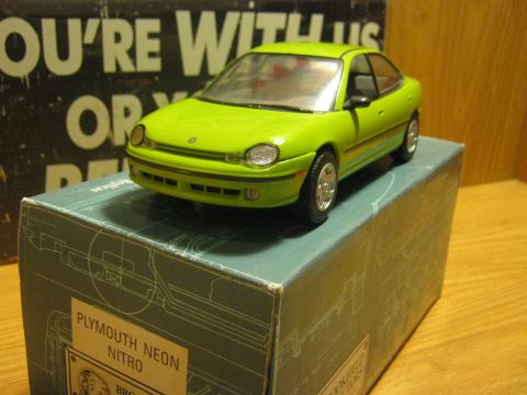 2010 Mitsubishi Outlander - Model car identified as a Plymouth Neon Nitro sits on its product box.