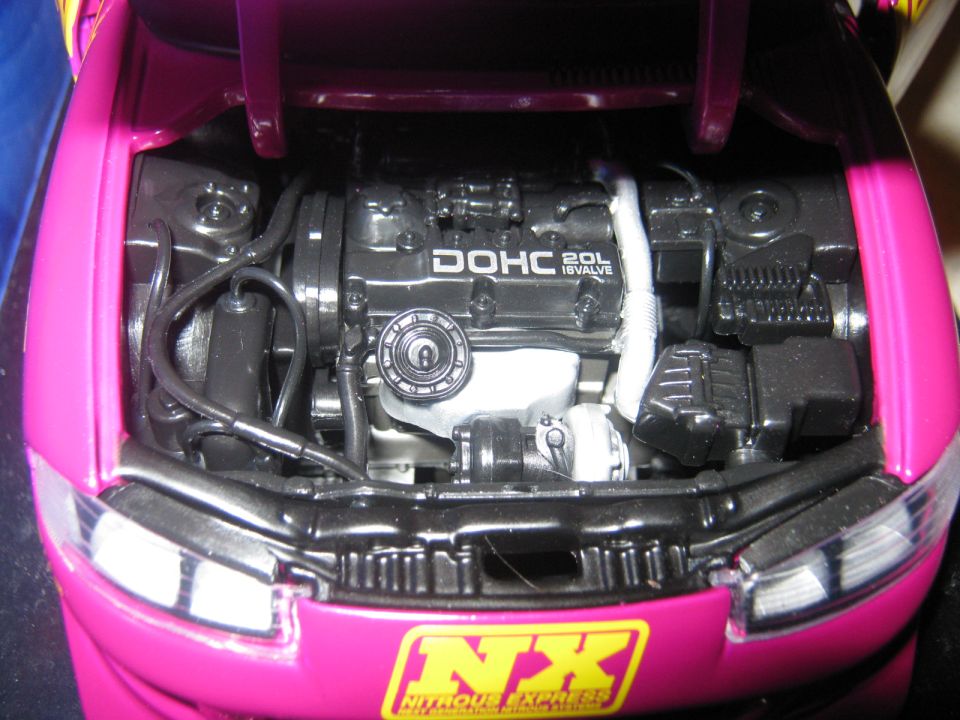 Pink model car engine bay with DOHC 2.0L 16valve engine and NX Nitrous Express sticker